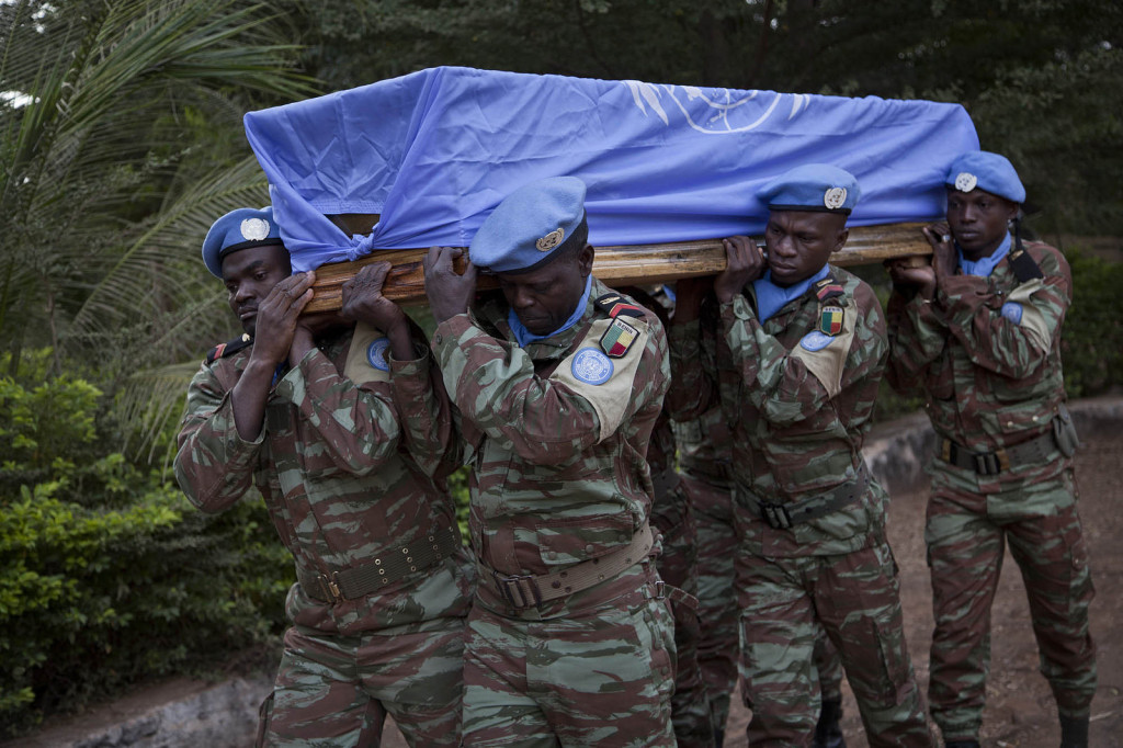 Blue helmets from Benin attend a funeral in honour of 2 Senegalese peacekeepers killed in Kidal, Mali last year. Photo Source: Mission de l'ONU au Mali - UN Mission in Mali via Flickr Creative Commons