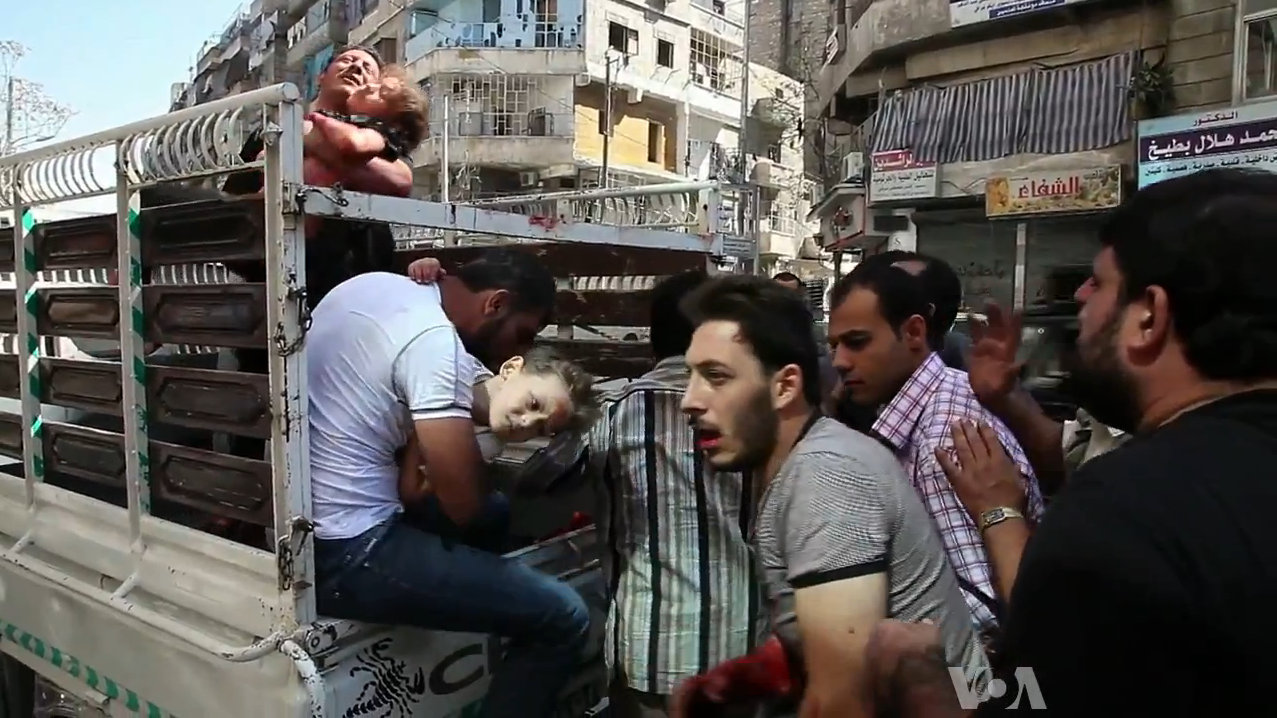Wounded civilians arrive at a hospital in Aleppo. Photo source: Voice of America News: Scott Bob reports from Aleppo, Syria via Wikimedia Commons